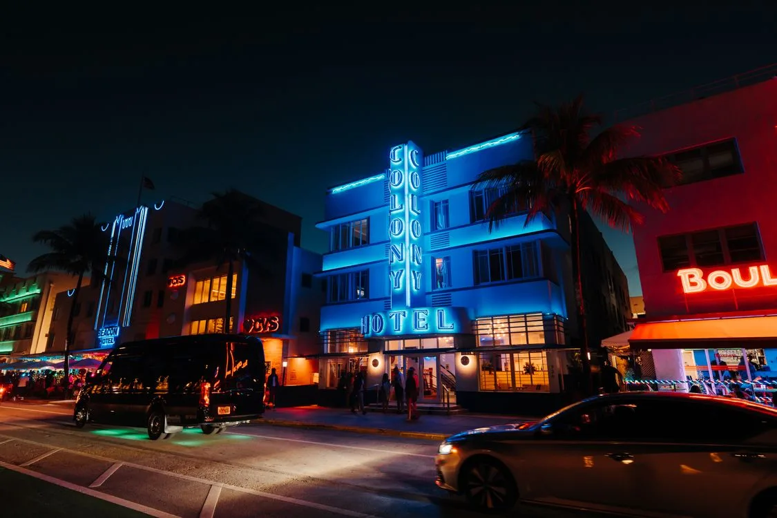 Neon-lit Miami street at night, the kind of drive made for gta 6 radio stations